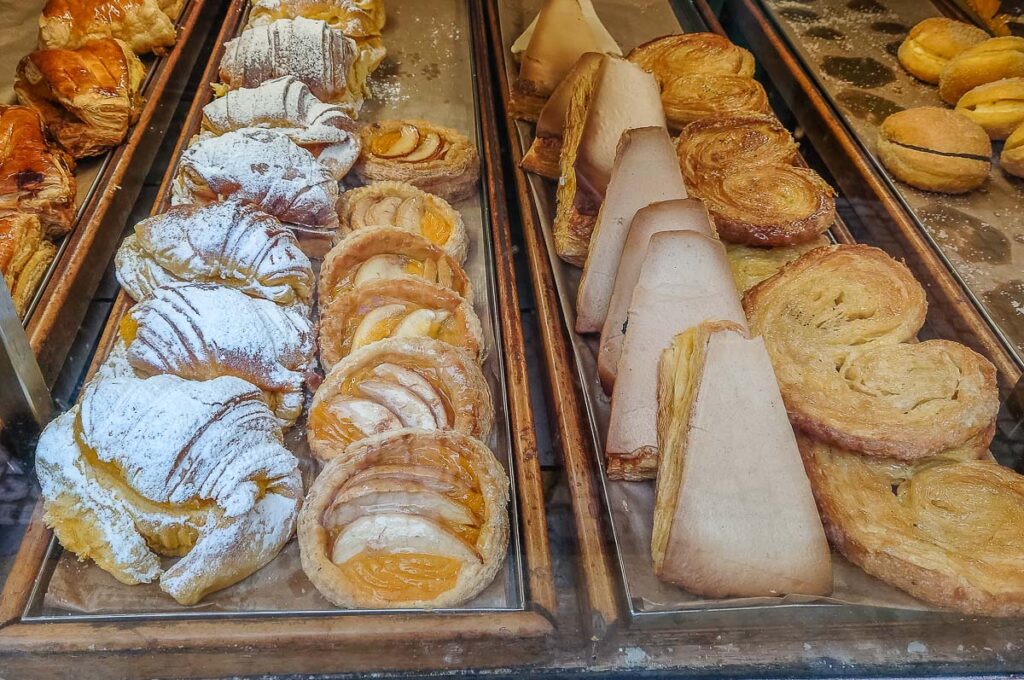 The window display of a traditional Portuguese patisserie selling pastries and desserts - Porto, Portugal - rossiwrites.com