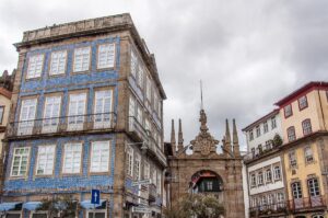 Buildings covered with azulejos and Arco da Porta Nova - Braga, Portugal - rossiwrites.com