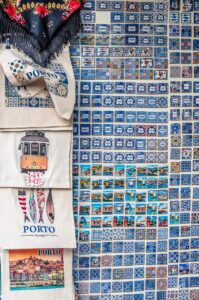 Magnets and bags stamped with images of Porto and sold in a souvenir shop - Porto, Portugal - rossiwrites.com