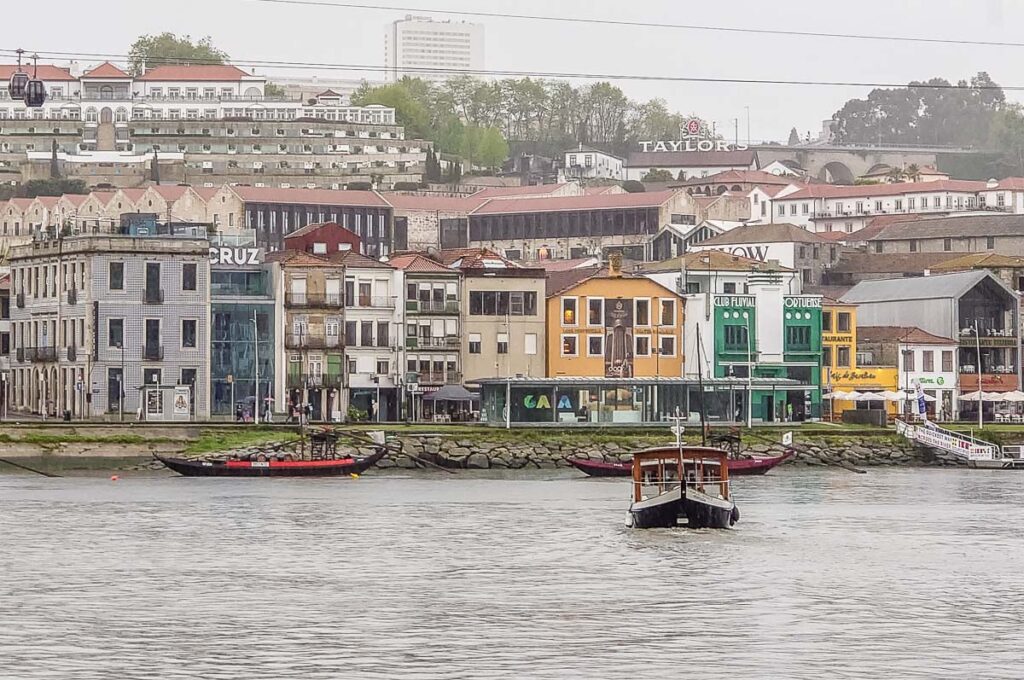 The Douro River Taxi boat arriving from Vila Nova da Gaia across the River Douro - Porto, Portugal - rossiwrites.com