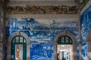 The azulejo-covered vestibule of the historic Sao Bento Train Station - Porto, Portugal - rossiwrites.com