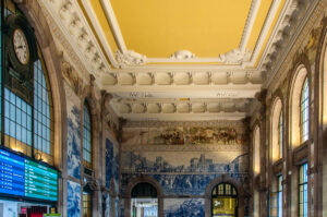 The azulejo-covered vestibule of the historic Sao Bento Train Station - Porto, Portugal - rossiwrites.com