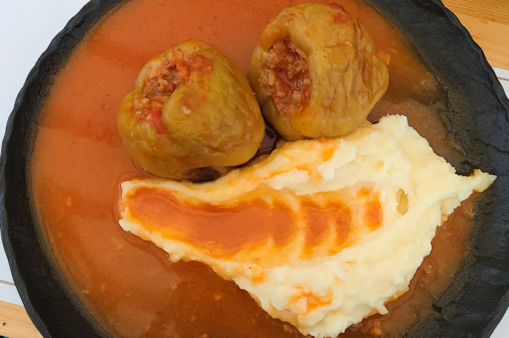 A portion of stuffed peppers with mash and sauce served in a local restaurant - Trogir, Croatia - rossiwrites.com