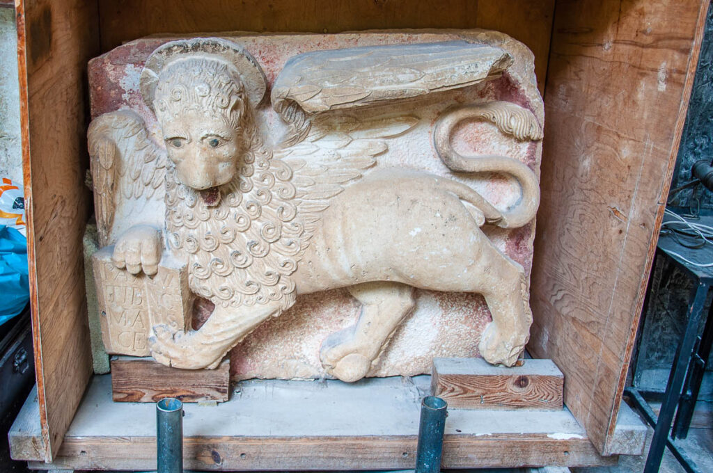 Crate with a bas-relief of the Venetian Lion in the cloister of the Monastery of St. Dominic - Trogir, Croatia - rossiwrites.com
