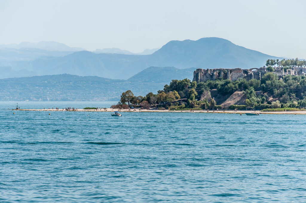 Grotte di Catullo and Jamaica Beach in Sirmione seen from the water - Lake Garda, Italy - rossiwrites.com