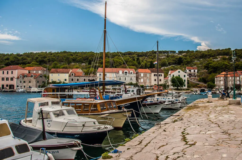 Harbour with boats and houses on the island of Zlarin in the Sibenik Archipelago - Dalmatia, Croatia - rossiwrites.com