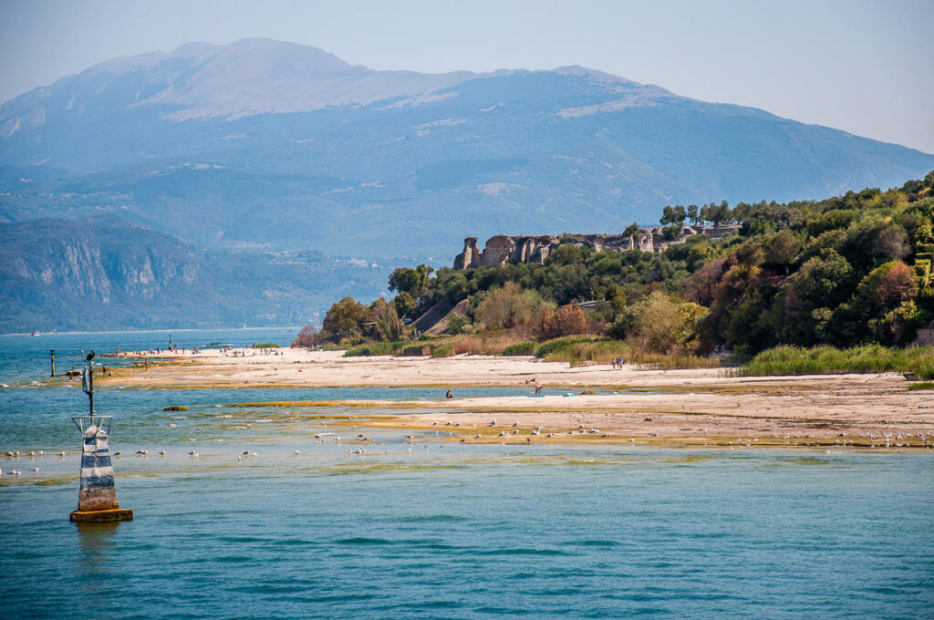 Jamaica Beach with Grotte di Catullo at the end of the Sirmio Promontory - Spiaggia Giamaica, Lake Garda, Italy - rossiwrites.com