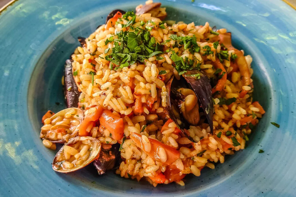 Seafood risotto served in a small local restaurant - Sirmione, Italy - rossiwrites.com