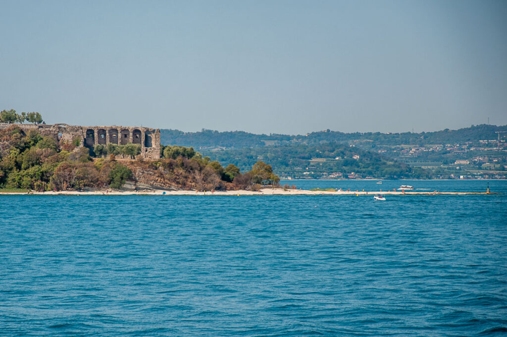 The Grotte di Catullo and Jamaica Beach seen from afar - Sirmione, Lake Garda, Italy - rossiwrites.com