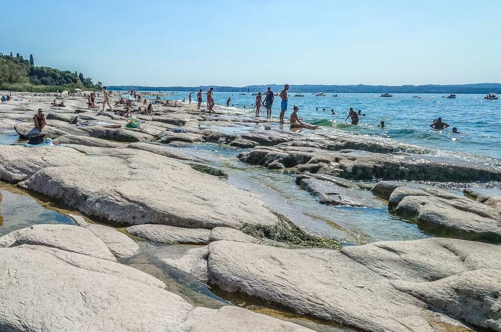 The flat rocks of Jamaica Beach - Sirmione, Lake Garda, Italy - rossiwrites.com