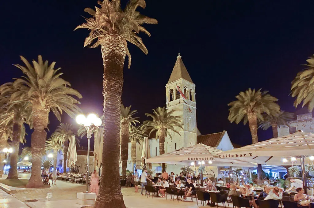 The lively promenade at night - Trogir, Croatia - rossiwrites.com