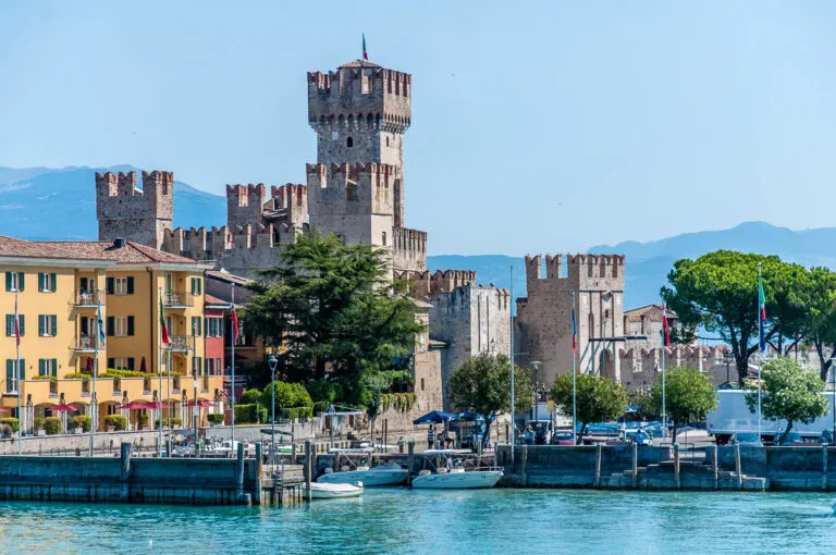 The medieval Scaliger Castle seen from the board of a ferry nearing Sirmione - Lake Garda, Italy - rossiwrites.com