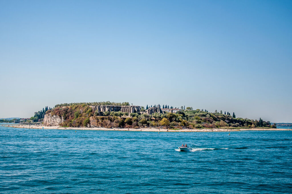 The tip of the promontory of Sirmio with Jamaica Beach with Grotte di Catullo - Sirmione, Lake Garda, Italy - rossiwrites.com