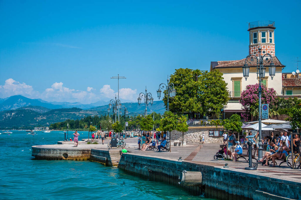 View of the lakefront promenade of the town of Lazise - Lake Garda, Italy - rossiwrites.com