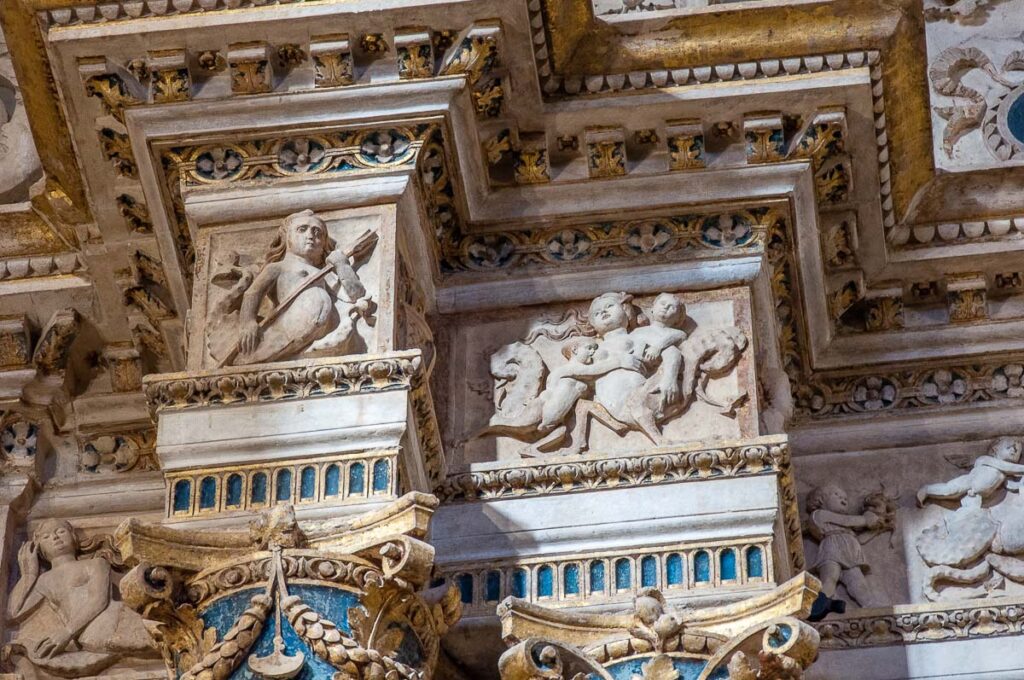 Close-up of the carved altar framing Giovanni Bellini's Baptism of Christ - Vicenza, Italy - rossiwrites.com