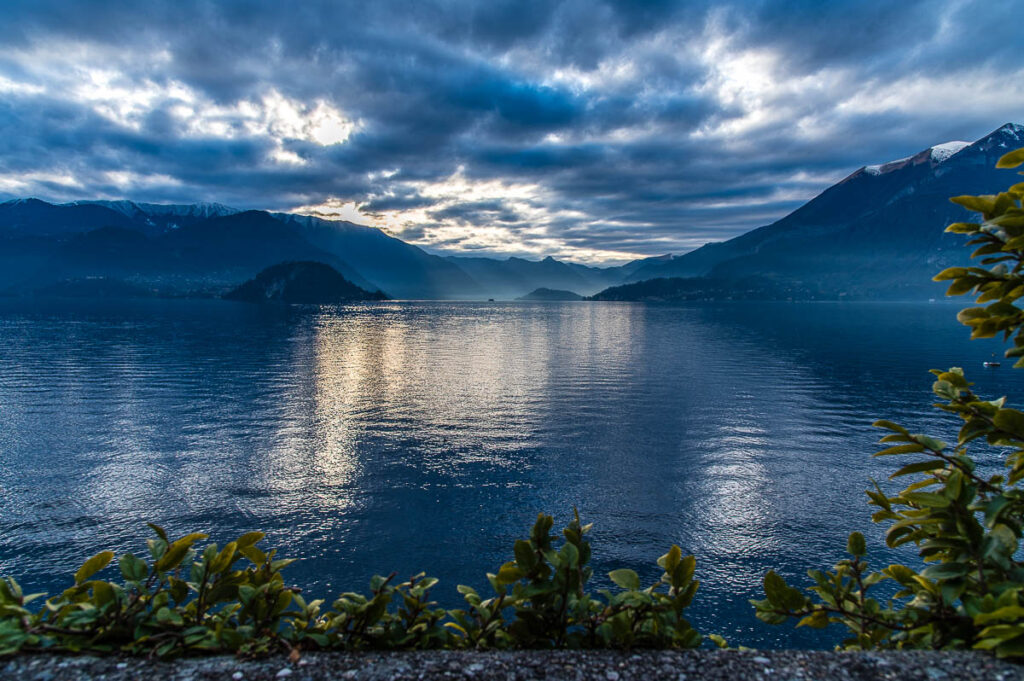 The blue expanse of the lake seen from the garden of Villa Monastero in the town of Varenna - Lake Como, Italy - rossiwrites.com