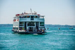 A large ferry boat approaching the town of Lazise - Lake Garda, Italy - rossiwrites.com