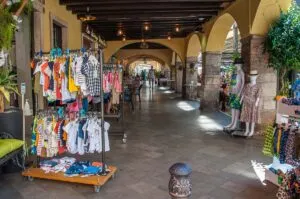 A long portico with shops in the historic centre of the town of Lazise - Lake Garda, Italy - rossiwrites.com
