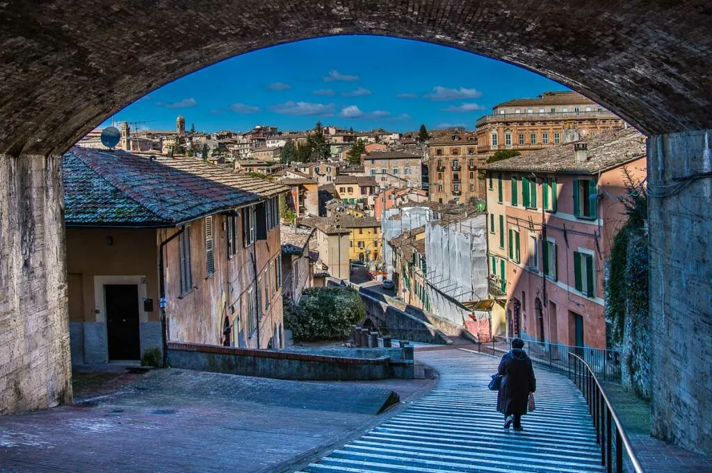 A view of the historic centre with the medieval aqueduct in the background - Perugia, Italy - rossiwrites.com