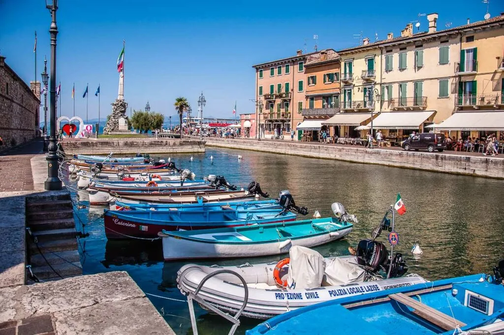 Boats in the old harbour in the historic centre of the town of Lazise - Lake Garda, Italy - rossiwrites.com