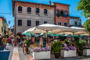 Restaurants and centuries-old houses in the historic centre of the town of Lazise - Lake Garda, Italy - rossiwrites.com
