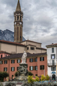 Statue and belltower in the historic centre of Lecco - Lake Como, Italy - rossiwrites.com