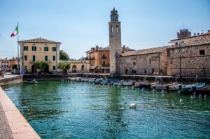 The historic harbour and the Church of San Nicolo in the town of Lazise - Lake Garda, Italy - rossiwrites.com