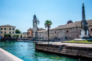 The historic harbour and the Church of San Nicolo in the town of Lazise - Lake Garda, Italy - rossiwrites.com