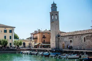 The historic harbour and the Church of San Nicolo in the town of Lazise - Lake Garda, Italy - rossiwrites.com
