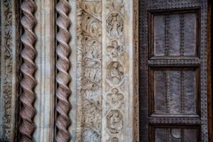 The richly ornamented doorway of the National Gallery of Umbria in Palazzo dei Priori in the historic centre - Perugia, Italy - rossiwrites.com