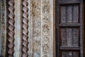 The richly ornamented doorway of the National Gallery of Umbria in Palazzo dei Priori in the historic centre - Perugia, Italy - rossiwrites.com