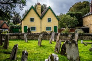 A cute cottage with the churchyard cemetery in the village of Shere - Surrey, England - rossiwrites.com