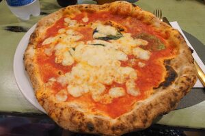 Classical Neapolitan pizza Margherita served in Pizzeria del Purgatorio on Via dei Tribunali - Naples, Italy - rossiwrites.com