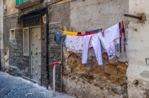 Clothes left to dry on a clothesline on the street - Rione Sanita - Naples, Italy - rossiwrites.com