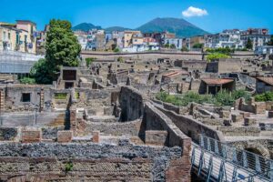 The Archeological Park of Herculaneum with Mount Vesuvius in the distance - Naples, Italy - rossiwrites.com