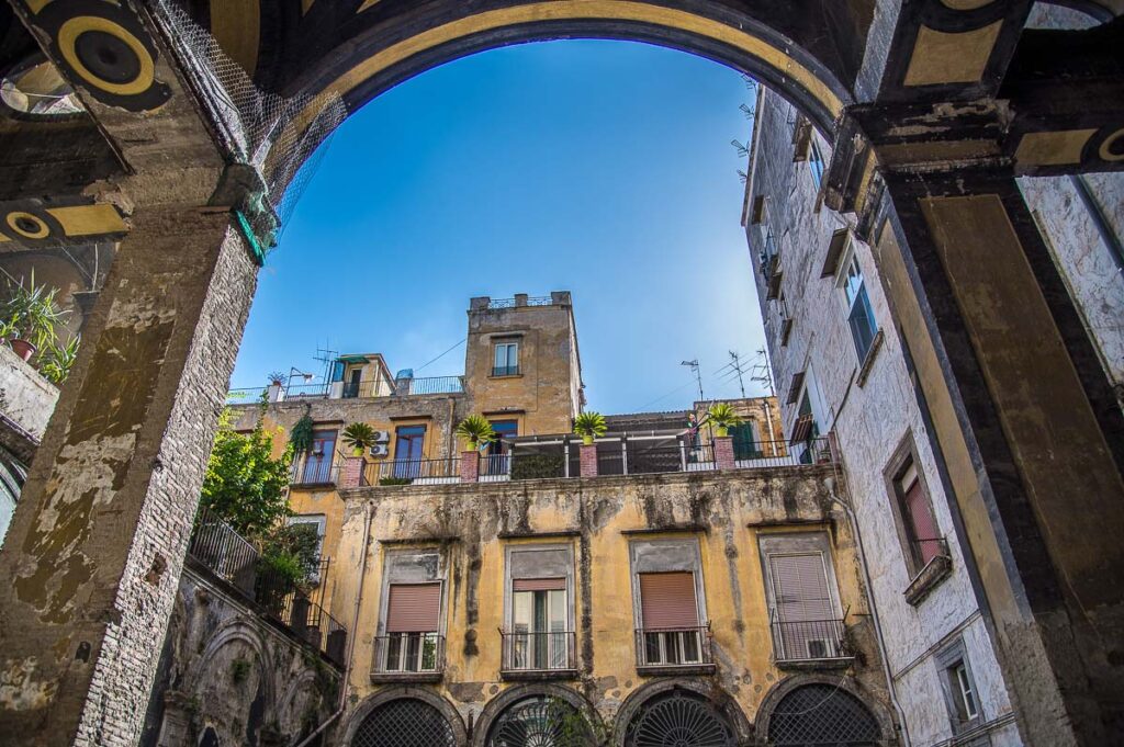 The courtyard of an 18th-century residential block of flats - Naples, Italy - rossiwrites.com