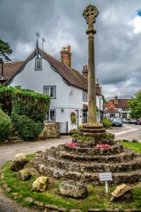 The war memorial and a beautiful cottage in the village of Shere - Surrey, England - rossiwrites.com