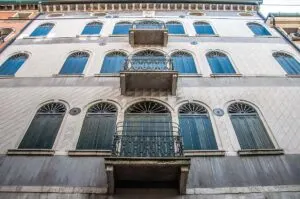 Beautiful facade with shutters and small balconies - Treviso, Italy - rossiwrites.com