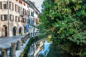 Historic houses alongisde a canal in the historic centre - Treviso, Italy - rossiwrites.com